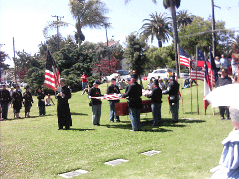 Draping U.S. Flag over coffin